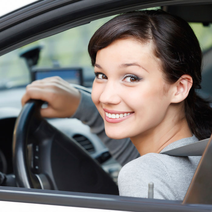Lady Smiling sitting in driver seat